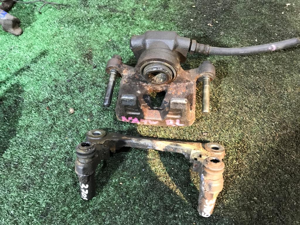 Суппорт левый задний MITSUBISHI GRANDIS NA4W 2 ракурс